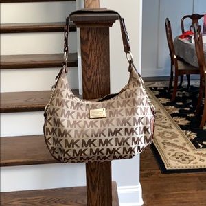 Michael Kors tan purse with leather strap